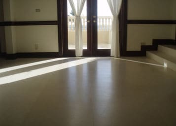 Dull limestone floor restored to a new polished and reflective finish