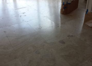 Saturnia floor restoration: deep-clean, fill holes, and refinish to shine